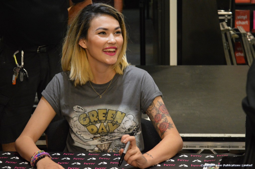 Neon Jungle signed copies of their album Welcome To The Jungle for eager fans.