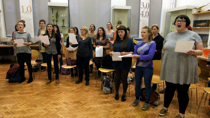 image of the choir rehearsing at Manchester Museum's Wonderstruck event